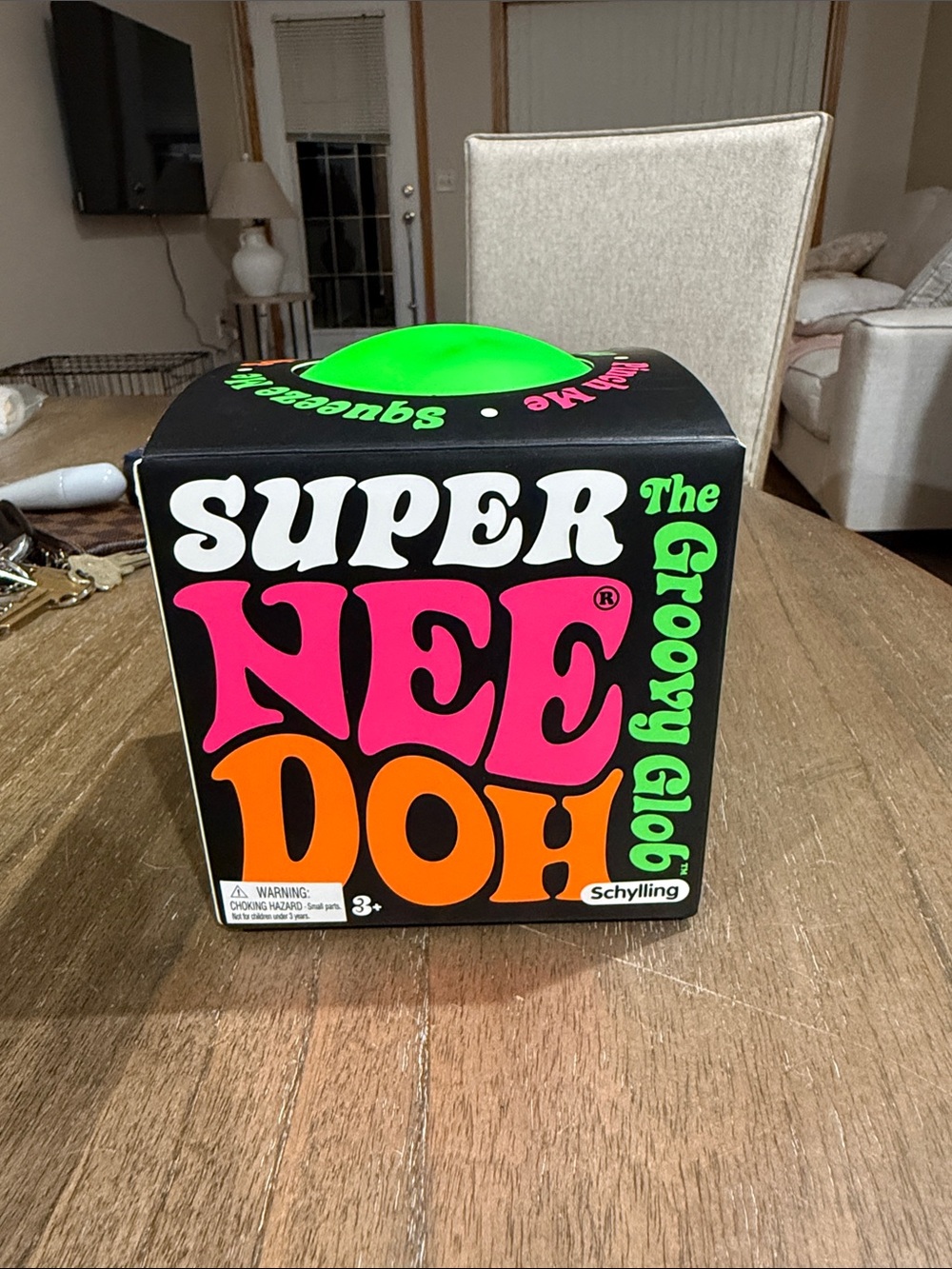 Super NeeDoh Groovy Glob Stress Ball - Black with Neon Pink, Orange & Green